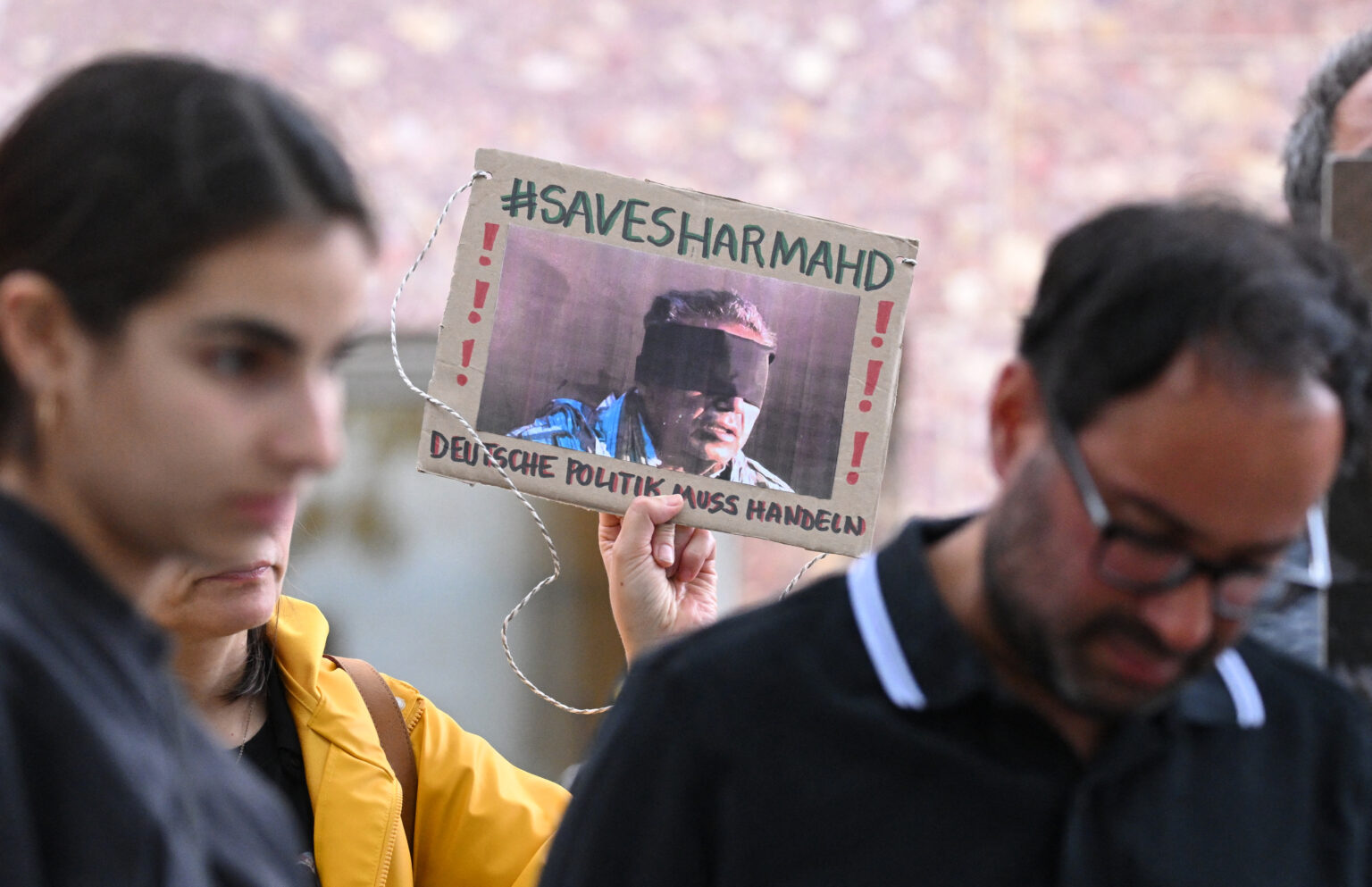 (FILES) A demonstrator holds a picture of Iranian-German Jamshid Sharmahd, who has been sentenced to death in Iran, with the…