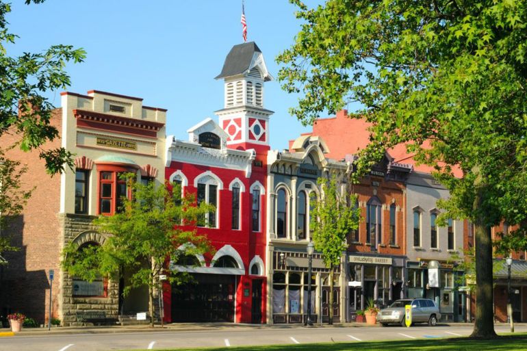 MEDINA, OH - MAY 19: East Washington Street in Medina, Ohio, on May 19, 2012, features a historic town hall and firehouse (bright red building) more than 130 years old.