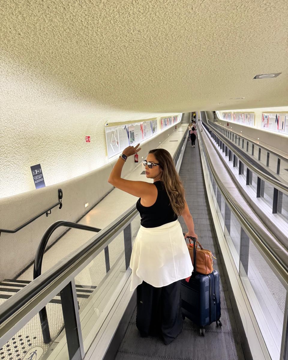 May be an image of 2 people and suitcase