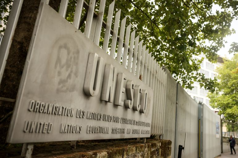 A man enters the UNESCO headquarters Tuesday, July 22, 2025 in Paris. (AP Photo/Thomas Padilla)