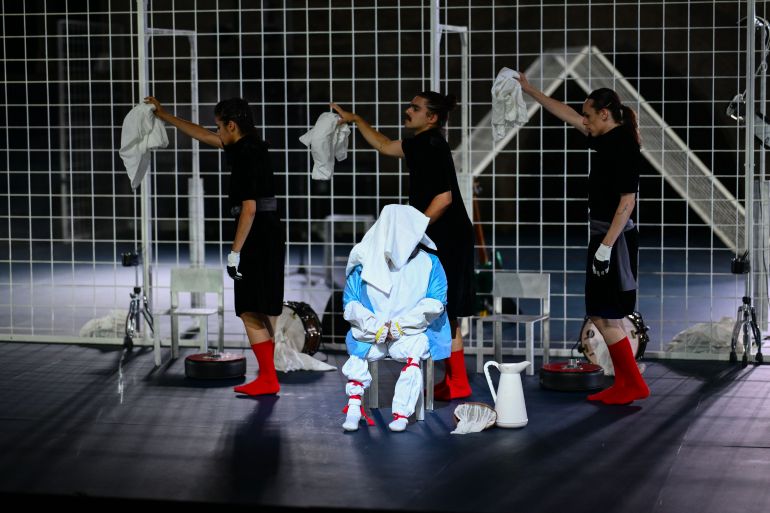 Actors perform in "Not" directed by Cape Verdean choreographer and dancer Marlene Monteiro Freitas during a rehearsal for the opening night of the Avignon Theatre festival, at the Palais des Papes in Avignon on July 3, 2025. Freitas, who will open the 79th Festival d'Avignon with a show inspired by the tales of the "Thousand and One Nights", is an outsider with a protean and colourful universe. (Photo by Christophe SIMON / AFP) / The erroneous mention[s] appearing in the metadata of this photo by Christophe SIMON has been modified in AFP systems in the following manner: [rehearsal] instead of [premiere]. Please immediately remove the erroneous mention[s] from all your online services and delete it (them) from your servers. If you have been authorized by AFP to distribute it (them) to third parties, please ensure that the same actions are carried out by them. Failure to promptly comply with these instructions will entail liability on your part for any continued or post notification usage. Therefore we thank you very much for all your attention and prompt action. We are sorry for the inconvenience this notification may cause and remain at your disposal for any further information you may require.