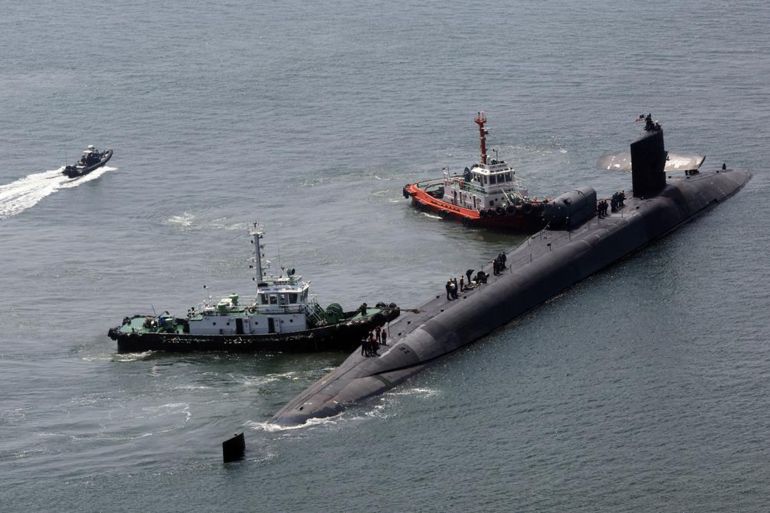 The nuclear-powered submarine USS Michigan approaches a naval base in Busan, South Korea, Friday, June 16, 2023. | Photo Credit: AP