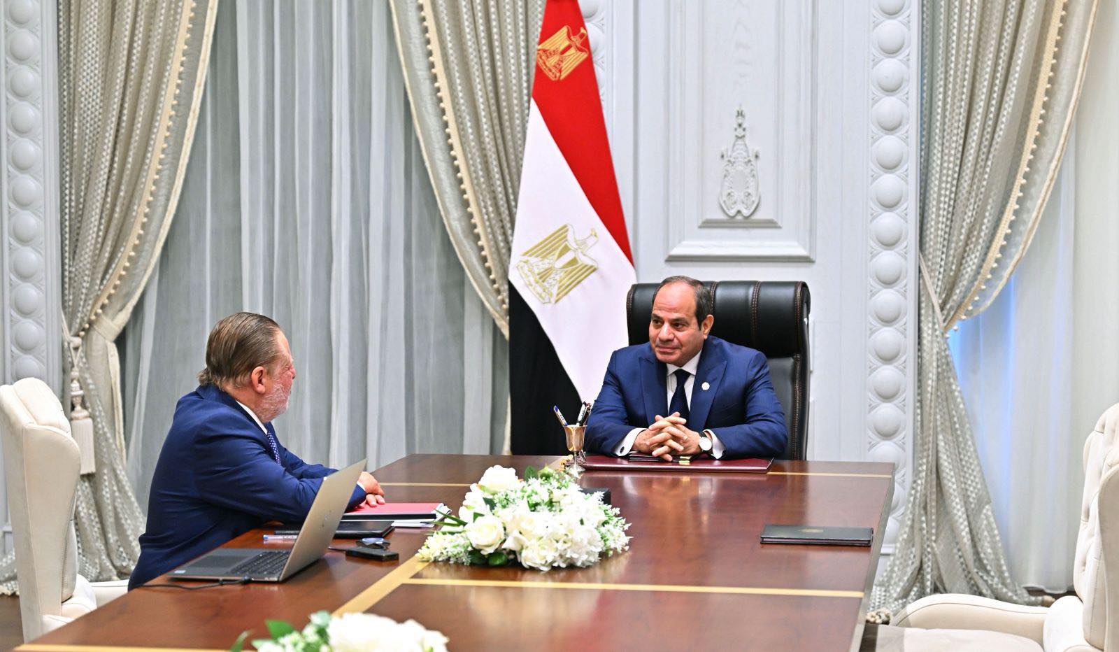 May be an image of 2 people, dais, the Oval Office and text