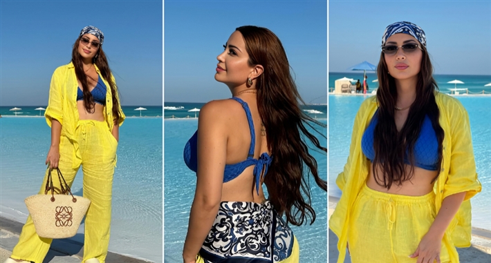 #شرطة_الموضة: نسرين طافش تعود لبحر الساحل بمايوه أزرق وحقيبة من Loewe سعرها 52 ألف جنيه | ألبوم نسرين طافش وجلسة تصوير جديدة من الساحل الشمالي