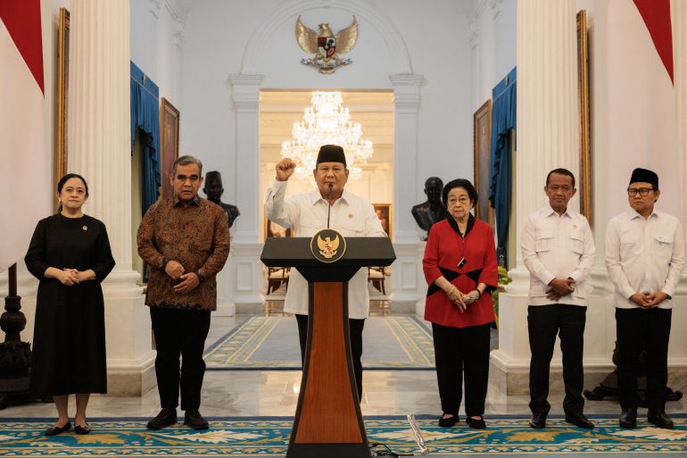Indonesia’s President Prabowo Subianto (3rd L) reacts as he speaks about a recent wave of nationwide protests during a press conference alongside political party leaders at the Presidential Palace in Jakarta on August 31, 2025.