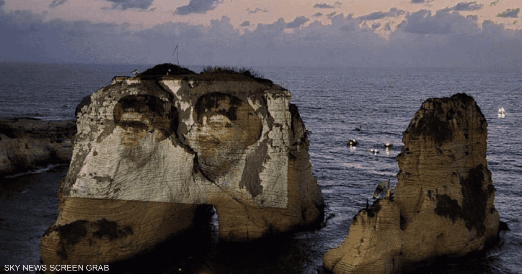 حزب الله يضيء “الروشة” بصورة نصرالله.. والنيابة العامة تتحرك حزب الله يضيء "الروشة" بصورة نصرالله.. والنيابة العامة تتحرك