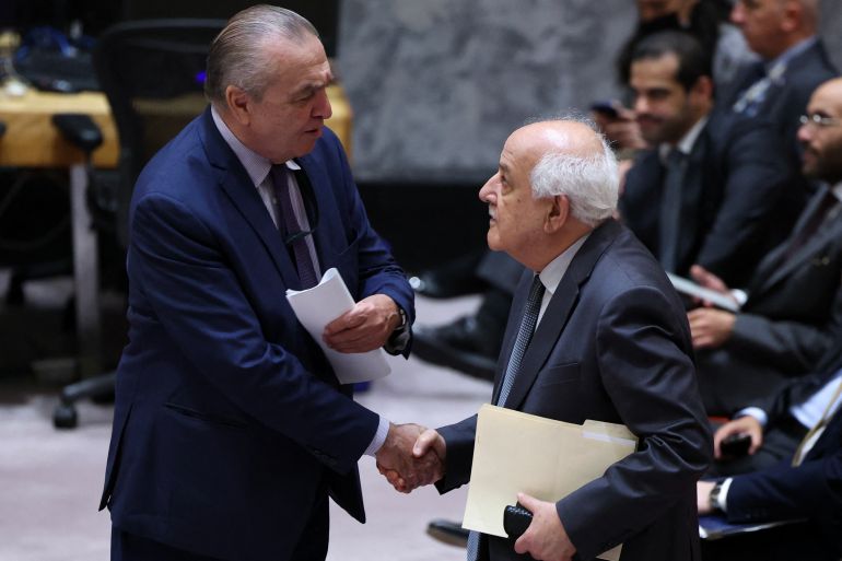 Algerian Ambassador to the UN Amar Bendjama (L), speaks with Palestinian Ambassador to the UN Riyad Mansour during a United Nations Security Council meeting on the situation in Gaza, at UN headquarters in New York on September 18, 2025.