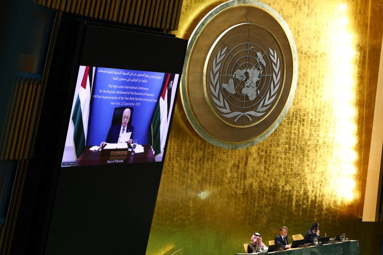 TOPSHOT - Palestinian Authority President Mahmud Abbas is displayed on a screen as he speaks remotely during a United Nations Summit on Palestinians at UN headquarters during the United Nations General Assembly (UNGA) in New York on September 22, 2025.