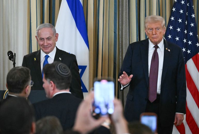 US President Donald Trump and Israeli Prime Minister Benjamin Netanyahu stand at the conclusion of a joint press conference in the State Dining Room of the White House in Washington, DC on September 29, 2025.