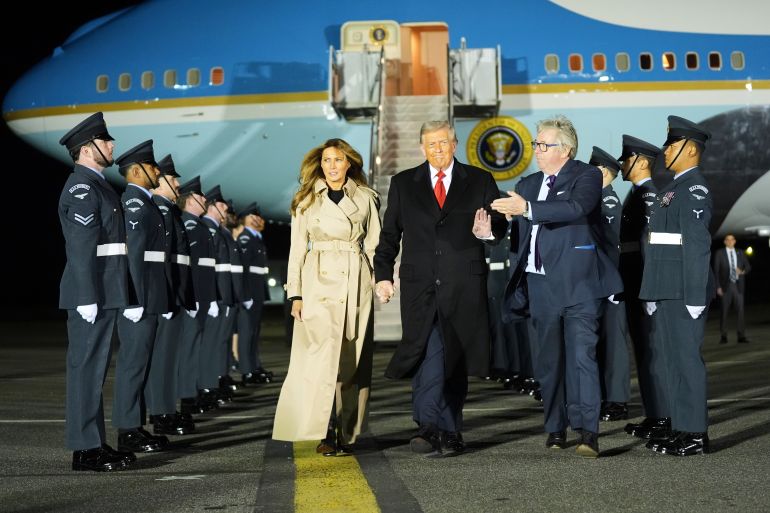 President Donald Trump and first lady Melania Trump are greeted by The Viscount Hood, Lord-in-Waiting, center, right, as they arrive at Stansted Airport near London, Tuesday, Sept. 16, 2025. (AP Photo/Evan Vucci)