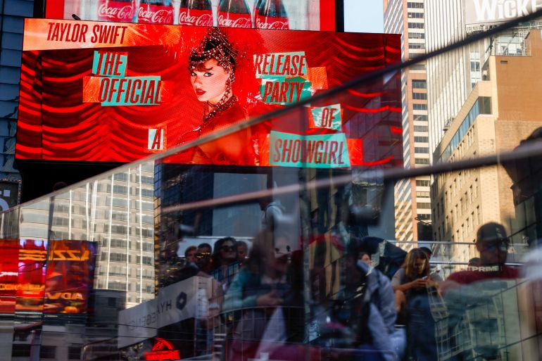 A billboard advertises "The Official Release Party of a Showgirl," a movie celebrating Taylor Swift’s new album "The Life of a Showgirl," in Times Square in New York City, U.S., October 3, 2025. REUTERS/Kylie Cooper