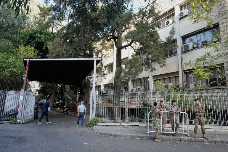 Lebanese soldiers stand guard outside the Justice Palace where former pop star turned militant Fadel Shaker appeared in court after 12 years on the run, in Beirut, Lebanon, Wednesday, Oct. 22, 2025. (AP Photo/Bilal Hussein)