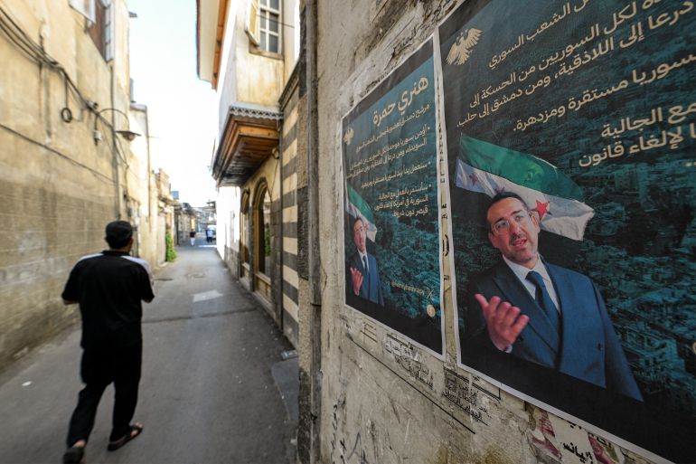 Election posters of Henry Hamra, a Syrian-American parliamentary candidate who is the son of the country's last rabbi and who if elected will be the first Jewish representative in the Syrian parliament since the late 1940s, are displayed on a wall along an alley in the Jewish quarter of the old city of Damascus on October 3, 2025, ahead of the upcoming vote on October 5.