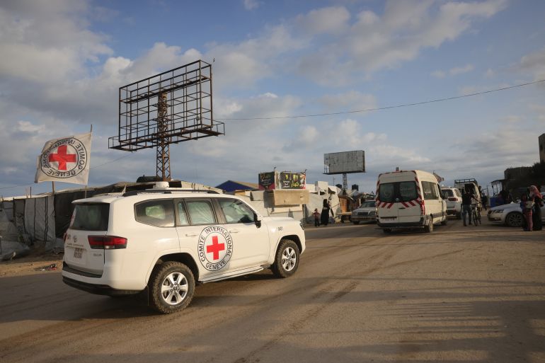 Red Cross vehicles move towards the northern Gaza Strip from Al-Zawayda city, near Deir al-Balah, in central Gaza on October 9, 2025, following an overnight announcement of a ceasefire deal between Hamas and Israel to be signed in Egypt.