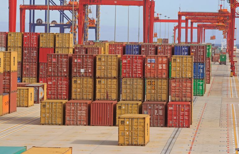 FILE - Shipping containers carrying goods bound for markets across the world wait for shipment at a port in Cape Town, South Africa, Thursday, March 28, 2013. (AP Photo/Schalk van Zuydam, File)