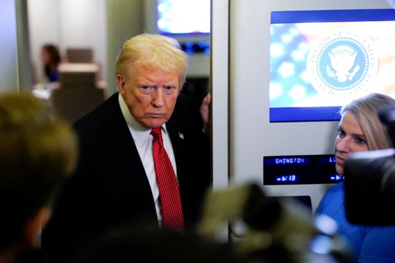 U.S. President Donald Trump looks on as he speaks to members of the media on board Air Force One en route to Joint Base Andrews, U.S., November 2, 2025. REUTERS/Elizabeth Frantz
