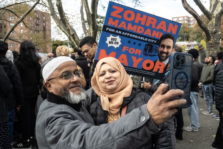 NEW YORK, NEW YORK - NOVEMBER 1: Supporters of Democratic New York City mayoral candidate Zohran Mamdani pose for a selfie during a campaign event with Mamdani and New York City elected officials on November 1, 2025 in the Queens borough of New York City. With only days left in the race for New York City's next mayor, Mamdani remains the front runner against Independent candidate, former New York Gov. Andrew Cuomo and Republican candidate Curtis Sliwa. Stephanie Keith/Getty Images/AFP (Photo by STEPHANIE KEITH / GETTY IMAGES NORTH AMERICA / Getty Images via AFP)