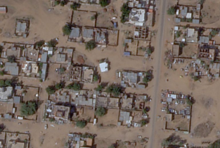 This satellite image by Planet Labs PBC shows a mosque, the center white building, and a discoloration in the soil just to the southeast of it after apparent digging there in the aftermath of an attack by the paramilitary Rapid Support Forces in el-Fasher, Sudan, Tuesday, Nov. 4, 2025. (Planet Labs PBC via AP)