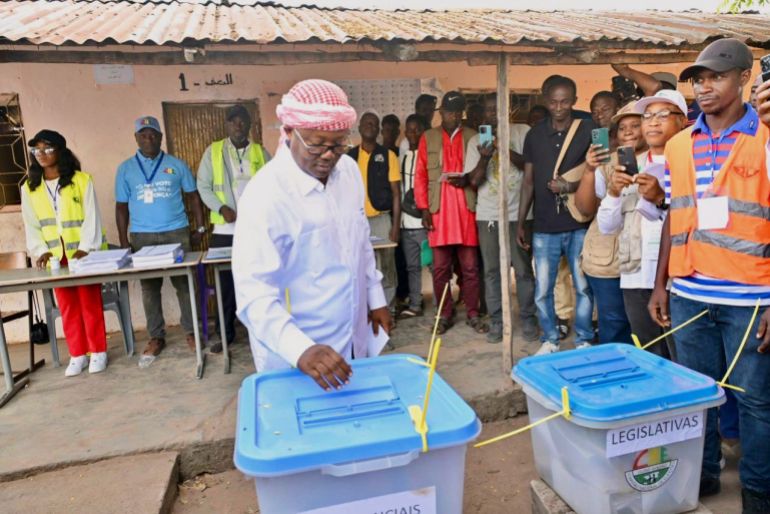 In this photo released by the Communication office Presidency republic of Guinea Bissau, incumbent President Umaro Sissoco Embalo casts his votes at a polling station during the Presidential and legislative elections in Bissau, Guinea-Bissau, Sunday, Nov. 23, 2025. (Communication office Presidency republic of Guinea Bissau via AP)