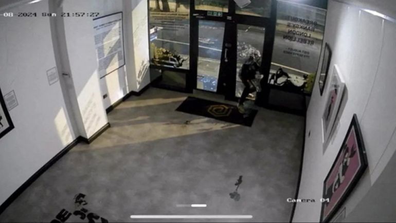 An undated handout photo taken from CCTV and released by the Metropolitan Police shows Larry Fraser, 49, using a hammer to smash his way into the Grove Gallery in the Fitzrovia to steal one of British street artist Banksy's best-known paintings, "Girl with Balloon", in London, Britain. Fraser was sentenced to 13 months in prison. Metropolitan Police/Handout via REUTERS THIS IMAGE HAS BEEN SUPPLIED BY A THIRD PARTY. BEST QUALITY AVAILABLE