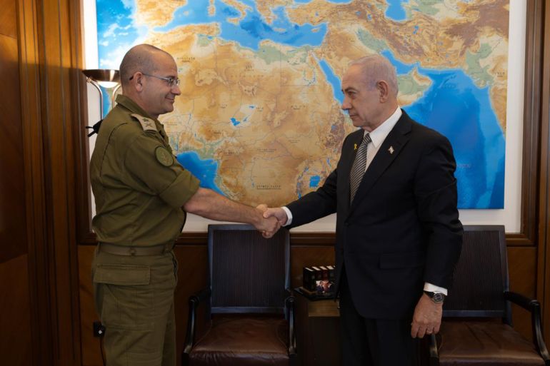 Prime Minister Benjamin Netanyahu (right) shakes hands with Maj. Gen. Roman Gofman, his military secretary, whom he nominated on December 4, 2025, to be the next director of the Mossad.