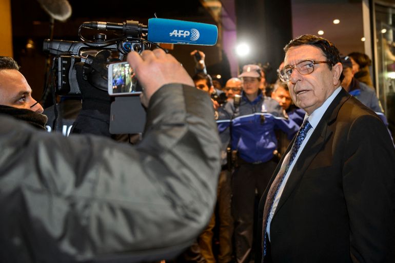 High Negotiations Committee (HNC) spokesman Riyad Naasan Agha (Syria's main opposition body ) reacts to the press upon his arrival on January 30, 2016 in Geneva for Syrian peace talks. Syria's main opposition body threatened to quit UN-mediated peace talks before they even get going as the rising death toll from starvation highlighted the dire humanitarian situation in the wartorn country. (Photo by FABRICE COFFRINI / AFP)