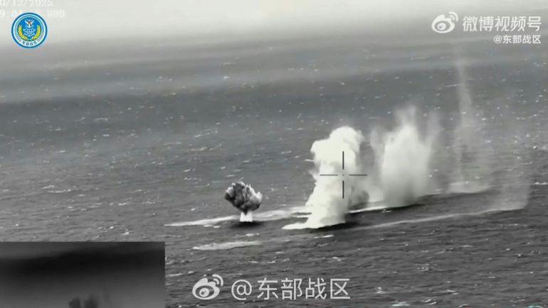 This frame grab from China's People's Liberation Army (PLA) Eastern Theater Command undated handout video footage released on December 30, 2025 via AFPTV shows rockets being fired into water in an undisclosed location.