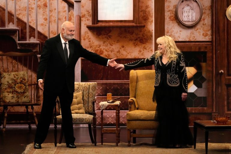 FILE - Rob Reiner, left, and Sally Struthers introducing the "In Memoriam" segment with a tribute to Norman Lear during the 75th Primetime Emmy Awards at the Peacock Theater, Jan. 15, 2024, in Los Angeles. (AP Photo/Chris Pizzello, File)