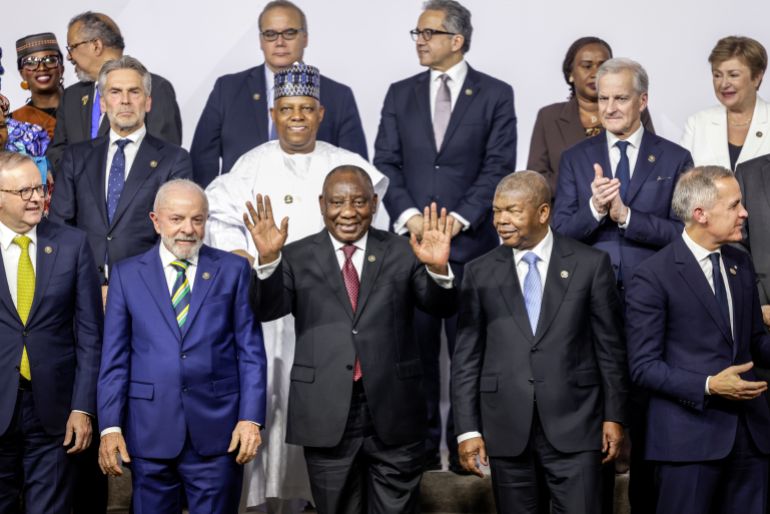 epa12542051 (1st row L-R): Australia's Prime Minister Anthony Albanese, Brazil's President Luiz Inacio Lula da Silva, South Africa's President Cyril Ramaphosa, President of Angola and Chairperson of the African Union Joao Lourenco and Canada’s Prime Minister Mark Carney react as they attend a family photo during the G20 Leaders' Summit at the Nasrec Expo Centre in Johannesburg, South Africa, 22 November 2025. World leaders are gathering in South Africa, the host of this year's G20 Leaders' Summit on 22 and 23 November 2025, to discuss the global economy, development and financing. EPA/GIANLUIGI GUERCIA / POOL