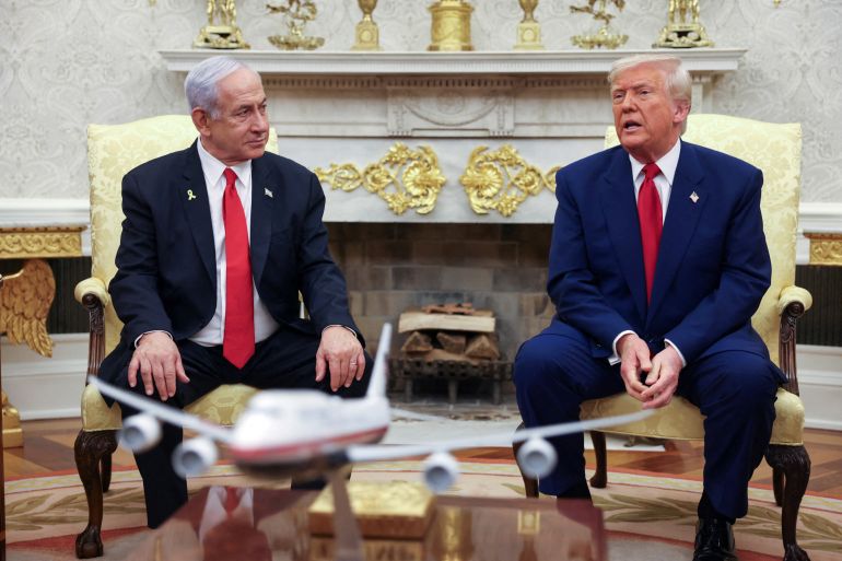 FILE PHOTO: U.S. President Donald Trump talks to Israeli Prime Minister Benjamin Netanyahu during a meeting where Trump announced nuclear talks with Iran, Washington, U.S., April 7, 2025. REUTERS/Kevin Mohatt/File Photo