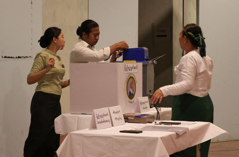 Polling officials prepare ahead of voting at Kyauktada Township Polling Station No. 1, on the day of general elections in Kyauktada, Myanmar, December 28, 2025. REUTERS/Stringer