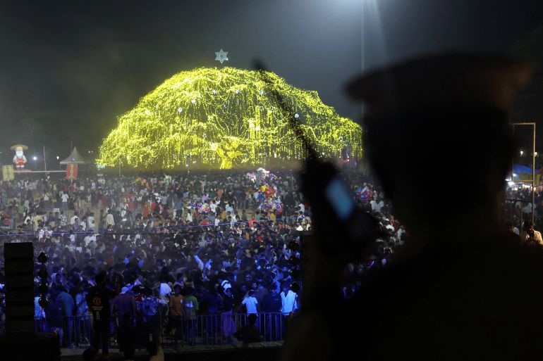 People gather to attend New Year's Eve celebrations in Fort Kochi, India, December 31, 2025. REUTERS/Priyanshu Singh