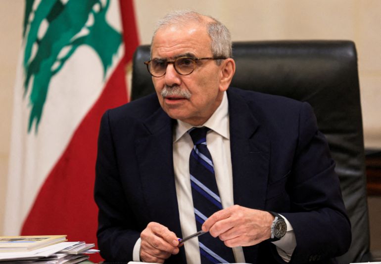 FILE PHOTO: Lebanese Prime Minister Nawaf Salam speaks to journalists at the government headquarters in Beirut, Lebanon, December 3, 2025. REUTERS/Mohamed Azakir/File Photo/File Photo