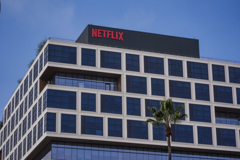 A Netflix sign is displayed atop a building in Los Angeles, Wednesday, Dec. 17, 2025. (AP Photo/Jae C. Hong)