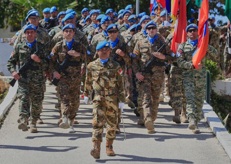 FILE - U.N. peacekeepers from different national contingents march during a ceremony to mark the 47th anniversary of UNIFIL Establishment Day, at the United Nation Peacekeepers headquarters in the southern Lebanese town of Naqoura, Lebanon, March 19, 2025. (AP Photo/Mohammed Zaatari, File)
