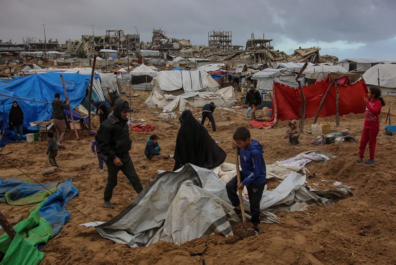 epa12638853 Displaced Palestinian families inspect their destroyed tents in the north of Gaza City, 09 January 2026. Fourteen Palestinians were killed on 08 January 2026 in Israeli air strikes in the Gaza Strip, amid a ceasefire between Israel and Hamas. Around 1.9 million people in Gaza, nearly 90 percent of the population, have been displaced since the Israel-Hamas conflict began in October 2023, according to the UN. EPA/MOHAMMED SABER