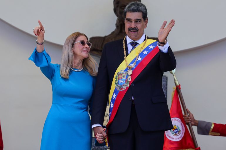 CARACAS, VENEZUELA - JANUARY 10: President of Venezuela Nicolas Maduro and his wife Cilia Flores hold hands and pose for photos after the swear-in ceremony at Palacio Federal Legislativo on January 10, 2025 in Caracas, Venezuela. Nicolas Maduro takes oath as president of Venezuela for a third consecutive term amidst tension in the country and a day after the opposition leader Maria Corina Machado was intercepted by governmental forces after taking part in an anti-government rally. Maduro claims to have won the election while the opposition leader Edmundo Gonzalez affirms he has won and, consequently, he is the legitimate president of Venezuela. (Photo by Jesus Vargas/Getty Images)