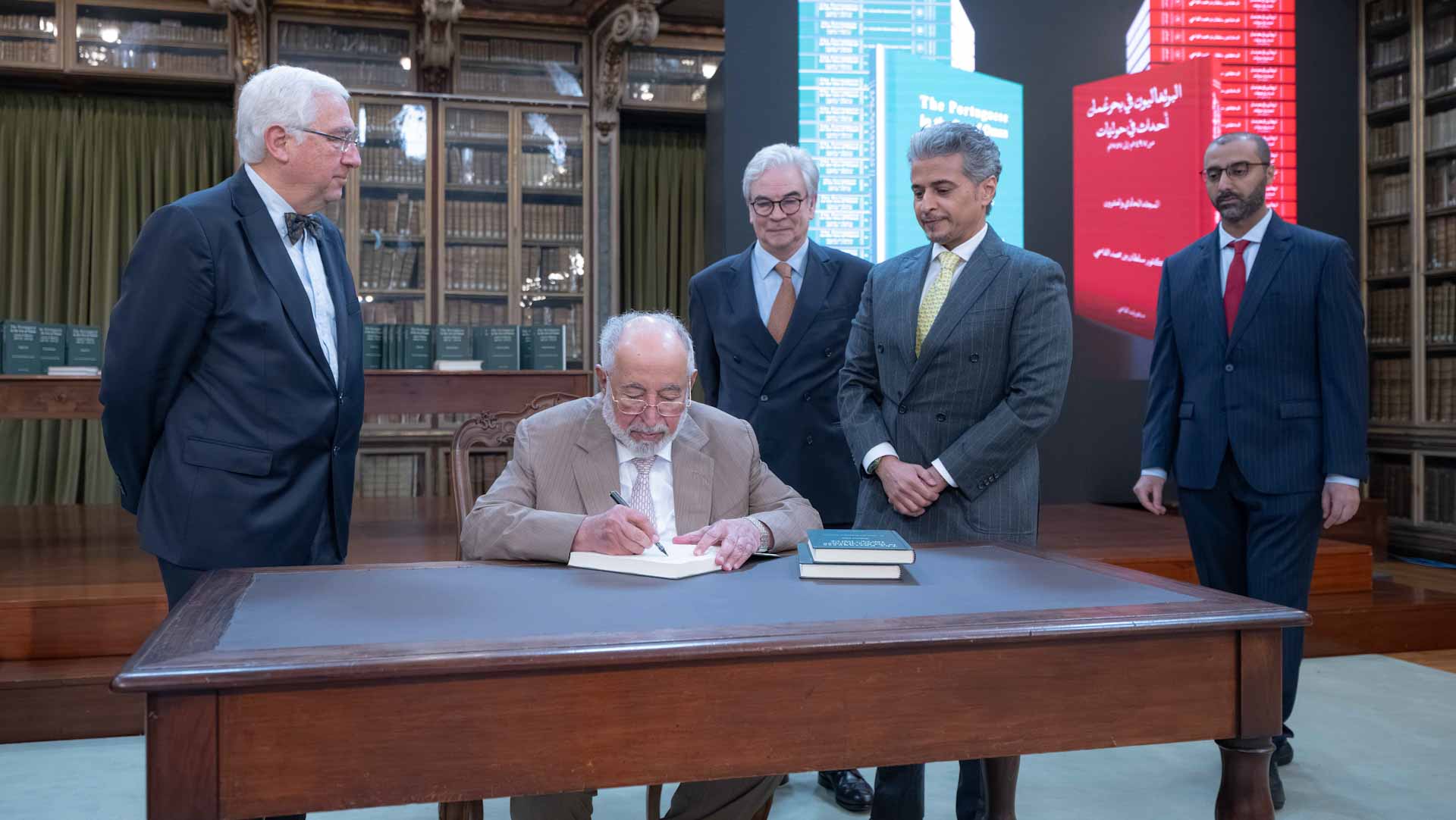 صورة بعنوان: <span class="scChromeData">{"commands":[{"click":"chrome:common:edititem({command:\"webedit:open\"})","header":"Edit the related item","icon":"/temp/iconcache/office/16x16/cubes.png","disabledIcon":"/temp/cubes_disabled16x16.png","isDivider":false,"tooltip":"Edit the related item in the Content Editor.","type":"common"},{"click":"chrome:rendering:personalize({command:\"webedit:personalize\"})","header":"Personalize","icon":"/temp/iconcache/office/16x16/users_family.png","disabledIcon":"/temp/users_family_disabled16x16.png","isDivider":false,"tooltip":"Create or edit personalization for this component.","type":"sticky"},{"click":"chrome:rendering:editvariations({command:\"webedit:editvariations\"})","header":"Edit variations","icon":"/temp/iconcache/office/16x16/windows.png","disabledIcon":"/temp/windows_disabled16x16.png","isDivider":false,"tooltip":"Edit the variations.","type":"sticky"}],"contextItemUri":"sitecore://master/{53727B62-5DBE-4C9F-9BBF-A324716936B1}?lang=ar&ver=1","custom":{},"displayName":"Title","expandedDisplayName":"This is require field and Maximum 90 character is allow"}</span><span sc_parameters="prevent-line-break=true" class="scWebEditInput scEnabledChrome" id="fld_53727B625DBE4C9F9BBFA324716936B1_E873DAB3C3324E8EB106973D9F53F5B7_ar_1_647078b095854f939f86bb49c8da4466_4601_edit" contenteditable="true" scdefaulttext="[No text in field]" scfieldtype="single-line text" sc-part-of="field">حاكم الشارقة يطلق النسخة البرتغالية من "البرتغاليون في بحر عُمان"</span>_9D076350BCB344C79FDC08F2730A24FE