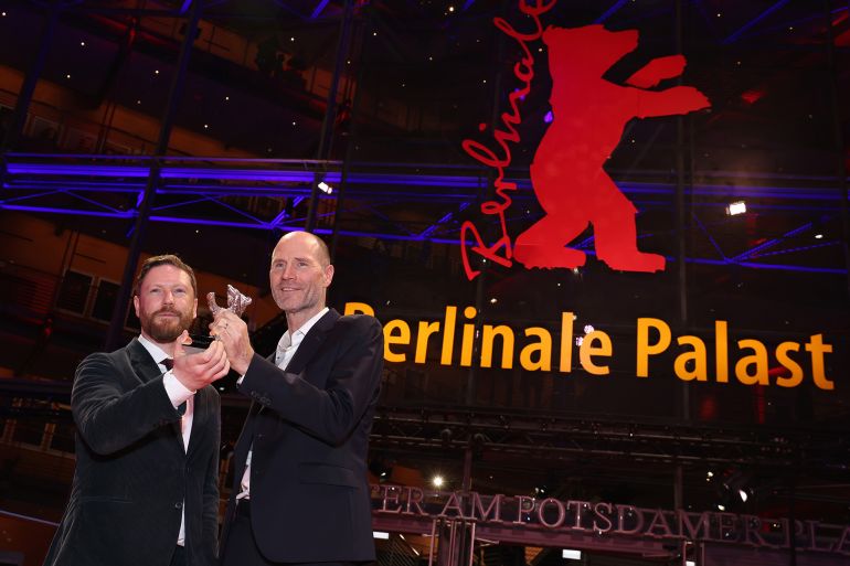BERLIN, GERMANY - FEBRUARY 21: Tristan Goligher and Lance Hammer pose with the Silver Bear Jury Prize for “Queen at Sea” on the red carpet after the Award Ceremony of the 76th Berlinale International Film Festival Berlin at Berlinale Palast on February 21, 2026 in Berlin, Germany. (Photo by Gerald Matzka/Getty Images)