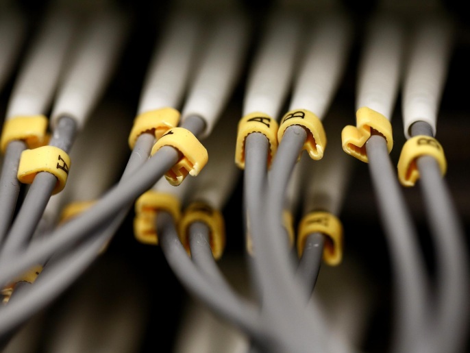Rows of fibre optic cables are seen feeding into a computer server inside a comms room at an office in London, U.K., on Tuesday, Dec. 23, 2014. Vodafone Group Plc will ask telecommunications regulator Ofcom to guarantee that U.K. wireless carriers, which rely on BT's fiber network to transmit voice and data traffic across the country, are treated fairly when BT sets prices and connects their broadcasting towers.