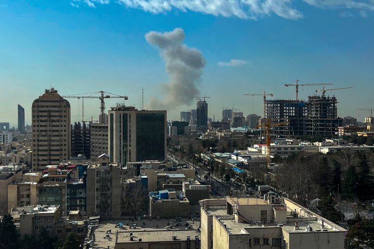 A plume of smoke rises following a reported explosion in Tehran on February 28, 2026. Israel's defence ministry announced February 28 it had launched a "preemptive strike" on Iran as sirens sounded in Jerusalem and people across the country received phone alerts about an "extremely serious" threat. (Photo by AFP)