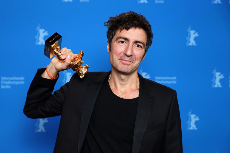 BERLIN, GERMANY - FEBRUARY 21: Ilker Çatak poses with the Golden Bear for Best Film for “Gelbe Briefe (Yellow Letters)” backstage during the awards ceremony of the 76th Berlinale International Film Festival Berlin at Berlinale Palast on February 21, 2026 in Berlin, Germany. (Photo by Sebastian Reuter/Getty Images)