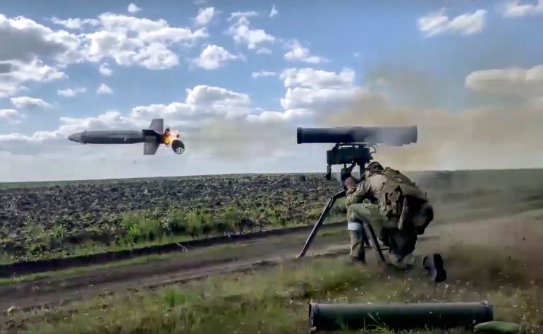 In this handout photo taken from video released by Russian Defense Ministry Press Service on Monday, Aug. 29, 2022, a Russian soldier fires from a Kornet, a Russian man-portable anti-tank guided missile on a mission at an undisclosed location in Ukraine. (Russian Defense Ministry Press Service via AP)