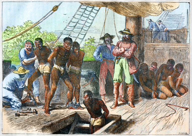 African slaves being taken on board ship bound for USA - engraving 1881 (Photo by Stefano Bianchetti/Corbis via Getty Images)