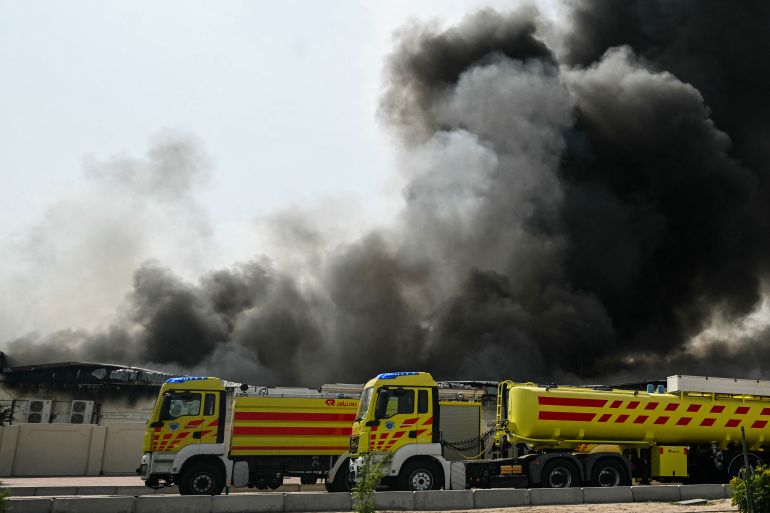 A plume of smoke rises from a reported Iranian strike in the industrial district of Doha on March 1, 2026.
