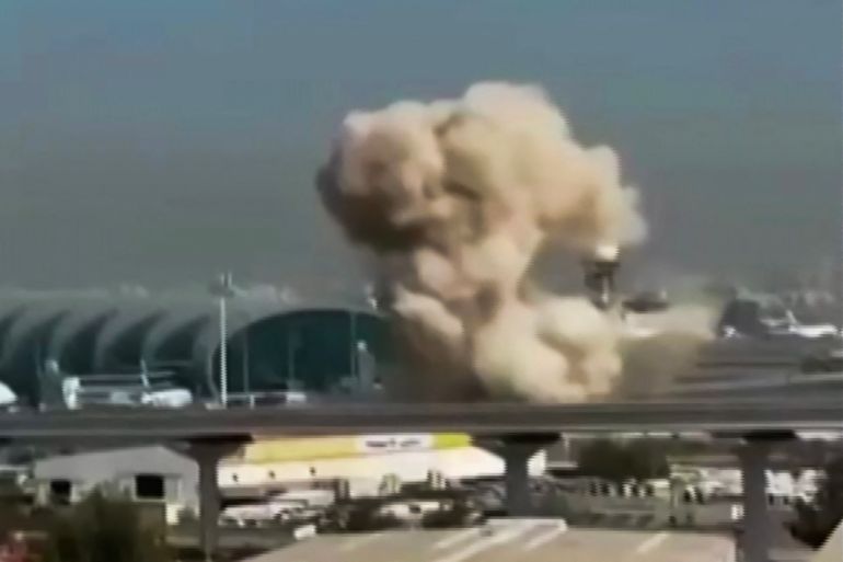 This video grab taken from UGC images posted on social media on March 7, 2026 shows smoke rising from the Dubai International Airport.
