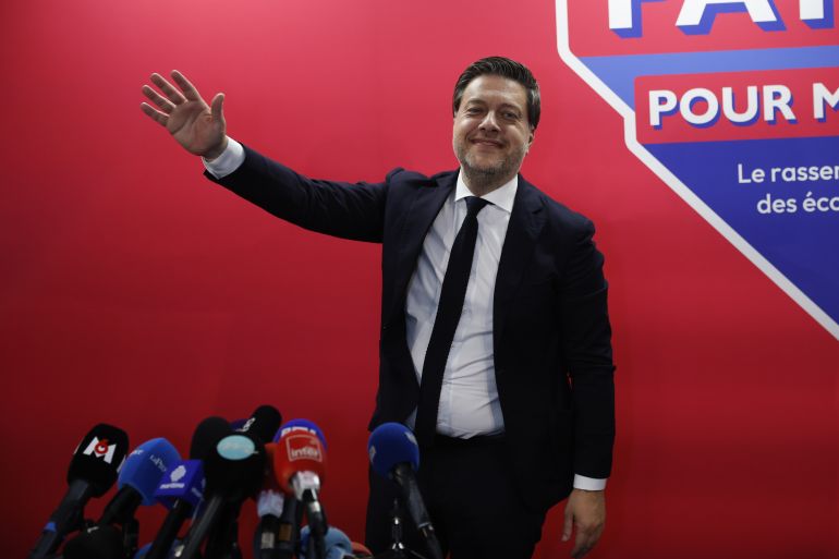 epa12842771 Marseille's mayor Benoit Payan, candidate supported by the left-wing parties, celebrates his win following the announcement of the preliminary results from the second round of the French municipal elections in Marseille, France, 22 March 2026. EPA/GUILLAUME HORCAJUELO