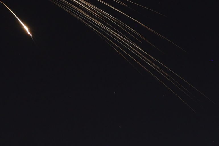 epa12829054 A photo made with a long exposure technique shows an Iranian cluster dispersal ballistic missile in the sky as sirens sound across central Israel, above Tel Aviv, Israel, 18 March 2026. EPA/ABIR SULTAN