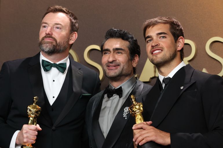 Hollywood, CA - March 15, 2026: Jack Piatt, left and Sam A. Davis, right, winners of the Live Action Short Film award for "The Singers", pose with Kumail Nanjiani, center, in the press room during the 98th Annual Academy Awards held by the Academy of Motion Picture Arts and Sciences at the Dolby Theatre in Hollywood, CA, Sunday, March 15, 2026. (Kayla Bartkowski / Los Angeles Times via Getty Images)