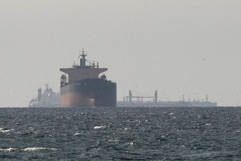 FILE PHOTO: Cargo ships in the Gulf, near the Strait of Hormuz, as seen from northern Ras al-Khaimah, near the border with Oman’s Musandam governance, amid the U.S.-Israeli conflict with Iran, in United Arab Emirates, March 11, 2026. REUTERS/Stringer/File Photo//File Photo